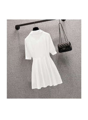 White slim fit plus size long sleeve top dress hanging on black hanger with quilted black purse