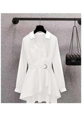 White V-neck long sleeve top with waist belt and layered peplum hem