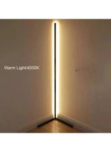 Warm white standing lamp with tall black pole and glowing LED tube on tripod base
