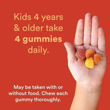 Hand holding gummy vitamins; directions for kids 4 years and older, four gummies daily.