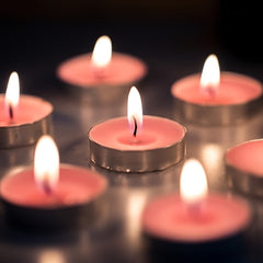 Huitich flameless smokeless tea light candles glowing with warm light in metal holders