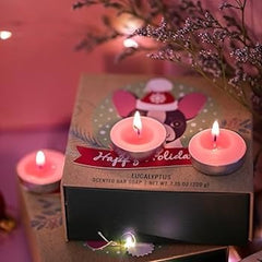 Huitich smokeless tea light candles glowing pink on holiday-themed packaging with floral background