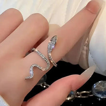Silver-tone snake ring with glittering pavé stones on an open band