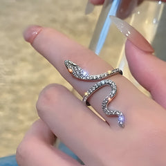 Huitich snake design ring silver wrapped around finger with detailed scales and sparkling accents