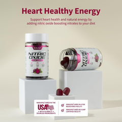 Snap Supplements cherry nitric oxide supplement gummies in bottles with gummies spilled on white pedestals