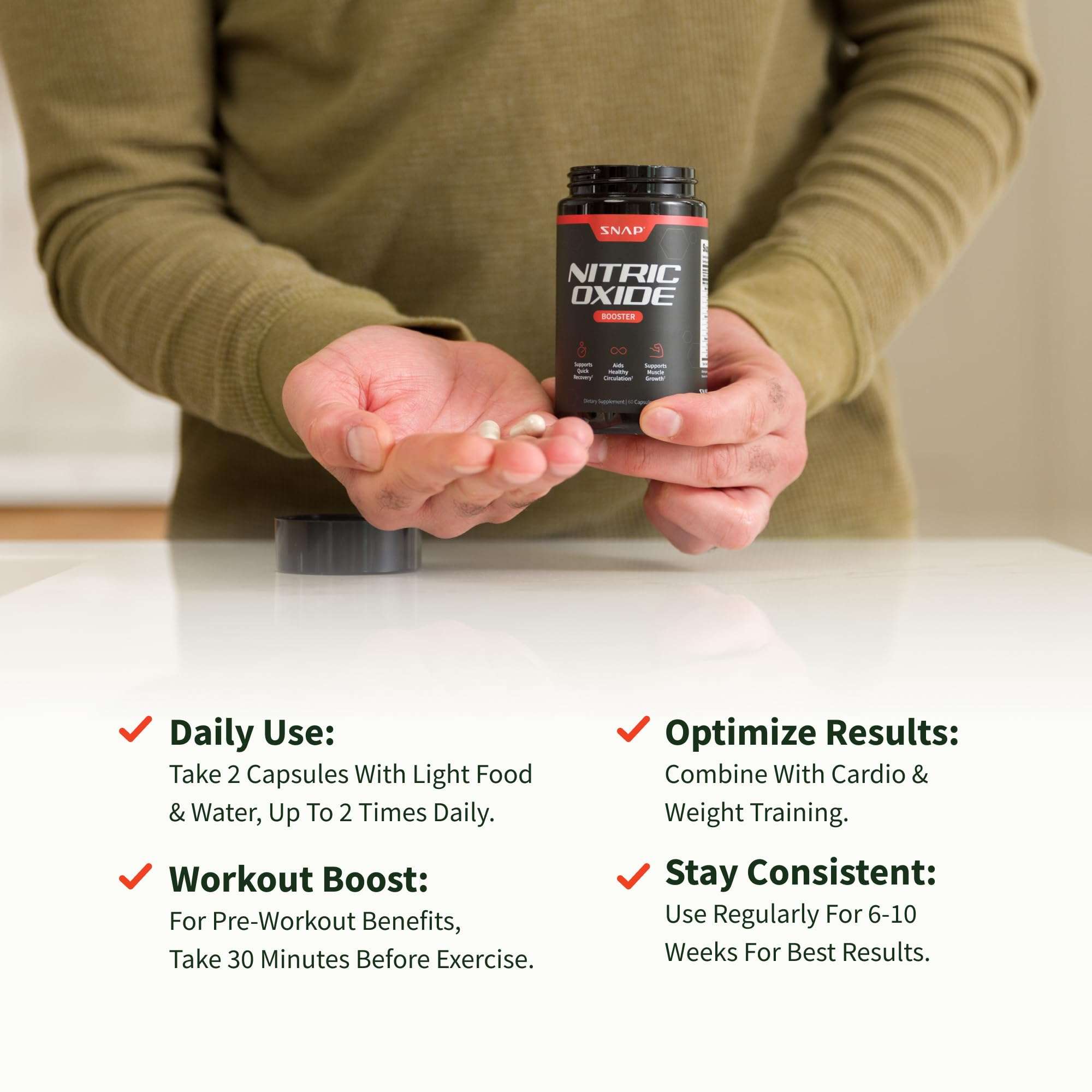 Snap Supplements nitric oxide supplement UAE bottle and capsules held over table with dosage and workout tips