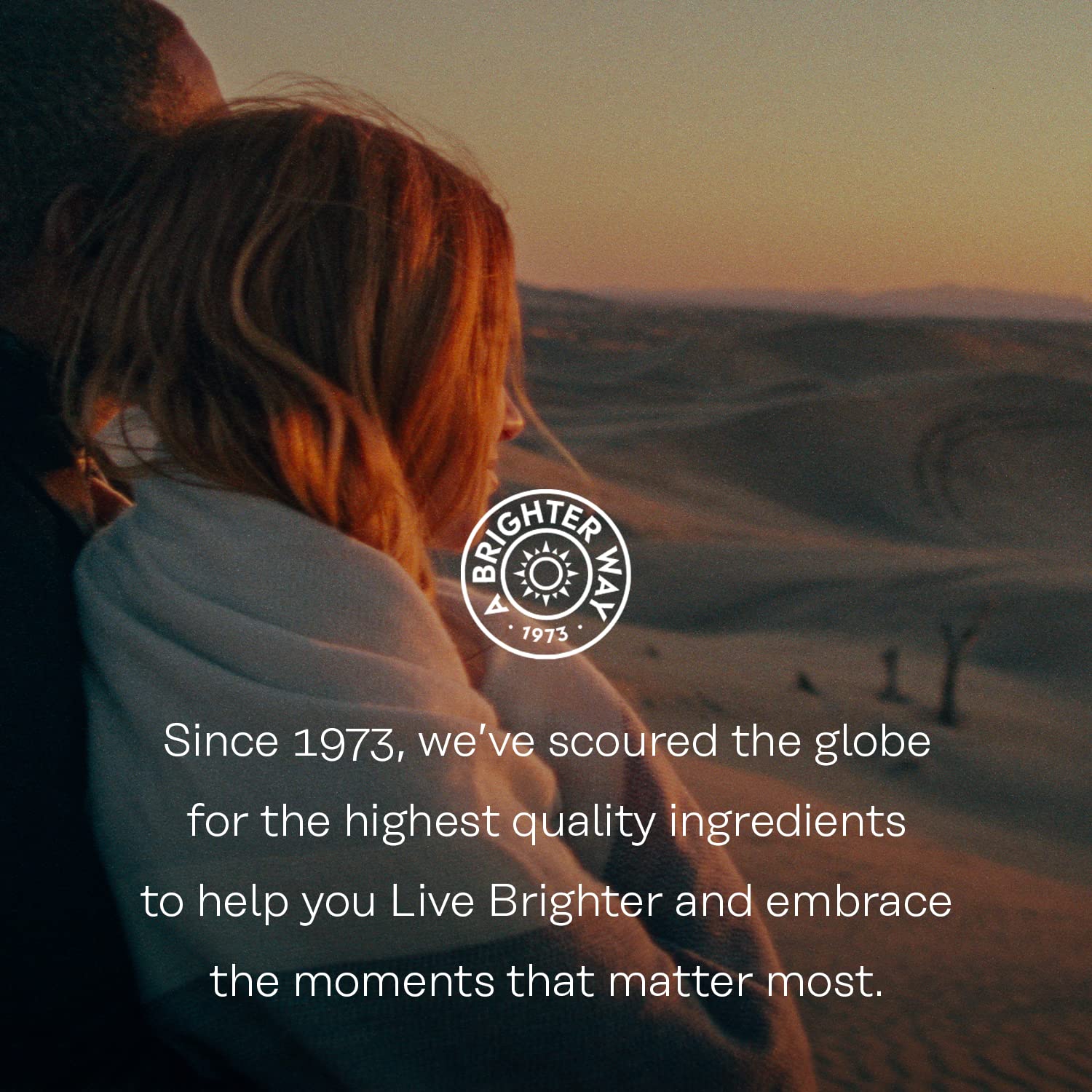 SOLARAY Berberine capsules for glucose metabolism lifestyle image of couple wrapped in blanket at sunset dunes