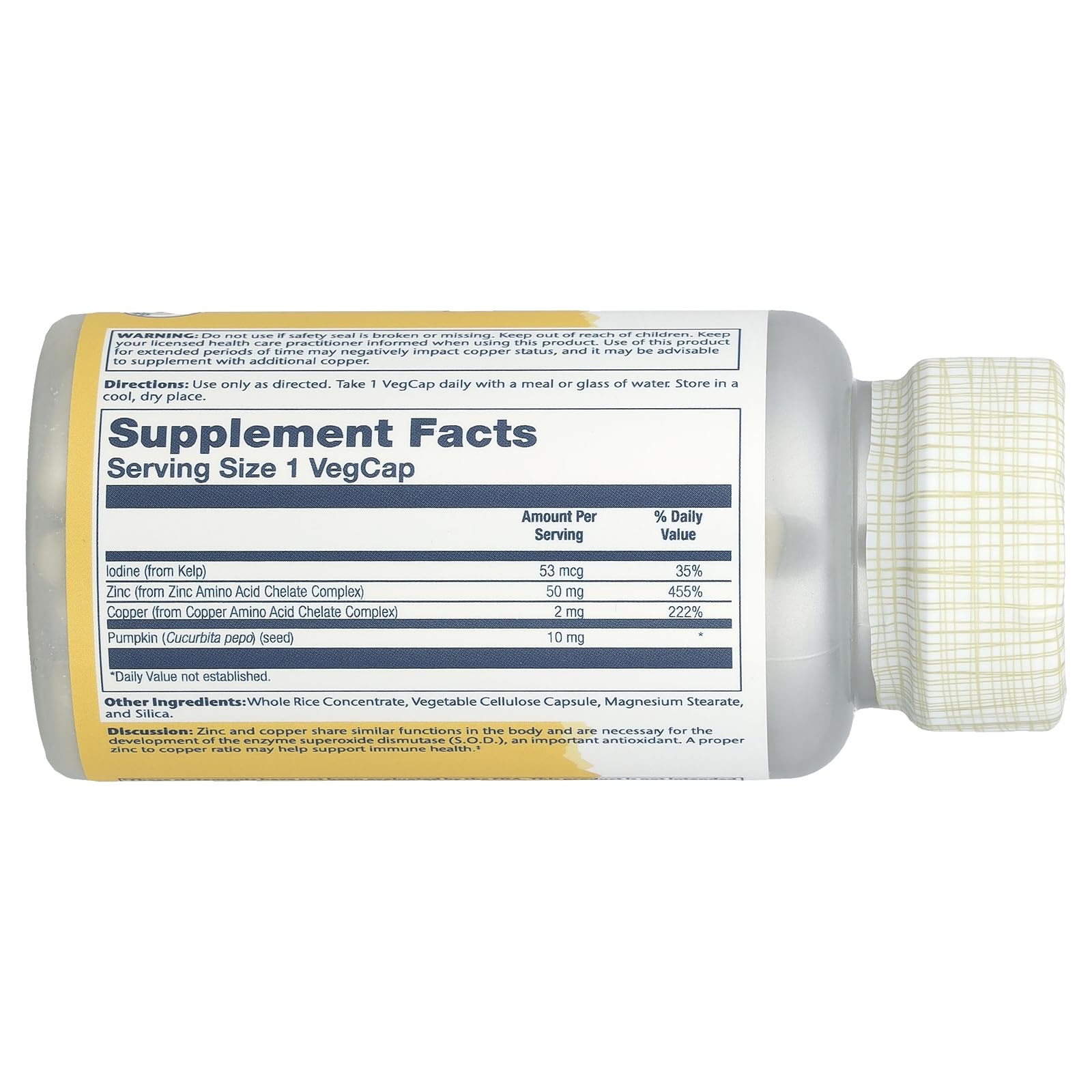 SOLARAY bottle showing Supplement Facts label of zinc and copper supplement capsules lying on side