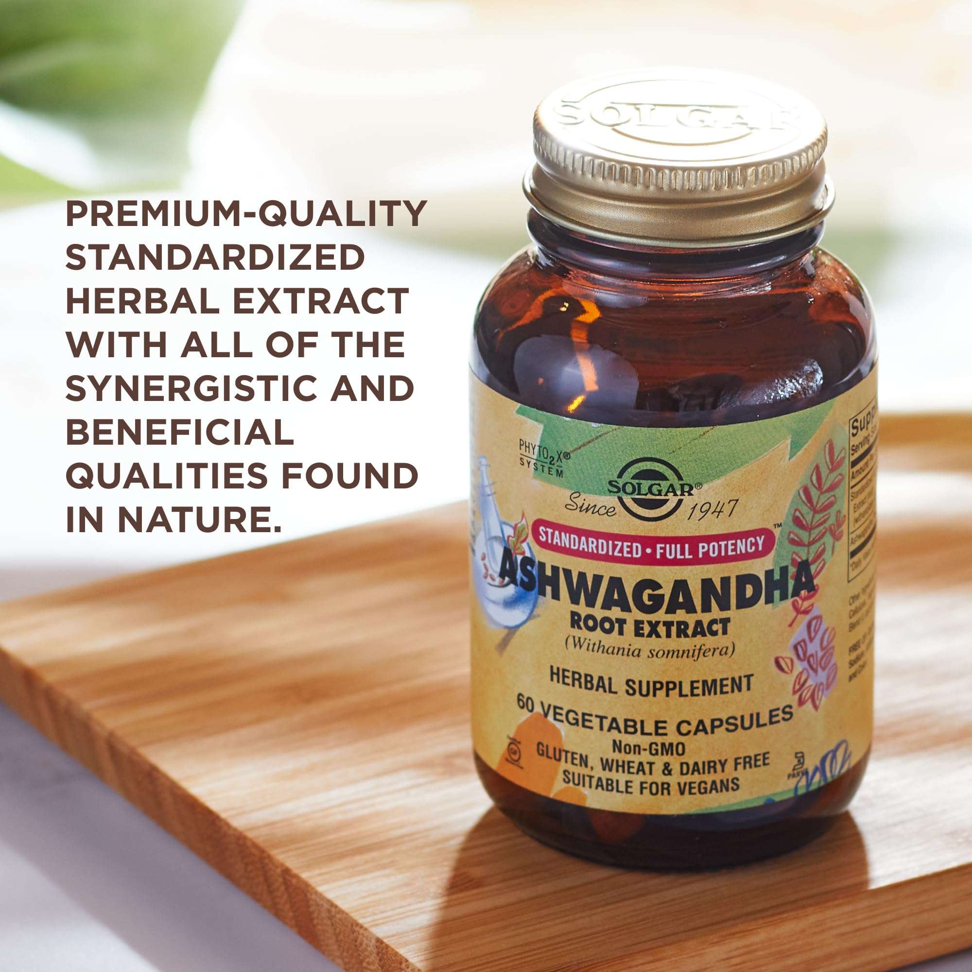 Solgar amber bottle of ashwagandha root extract capsules on wooden board with label and gold lid