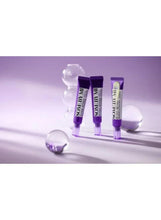 Multiple purple eye cream tubes with caps and clear nozzles