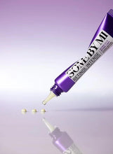 Purple eye cream tube dispensing small beige cream dots
