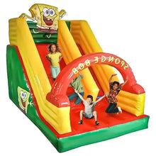 Inflatable SpongeBob bouncy castle with red arched slide, kids on yellow lanes