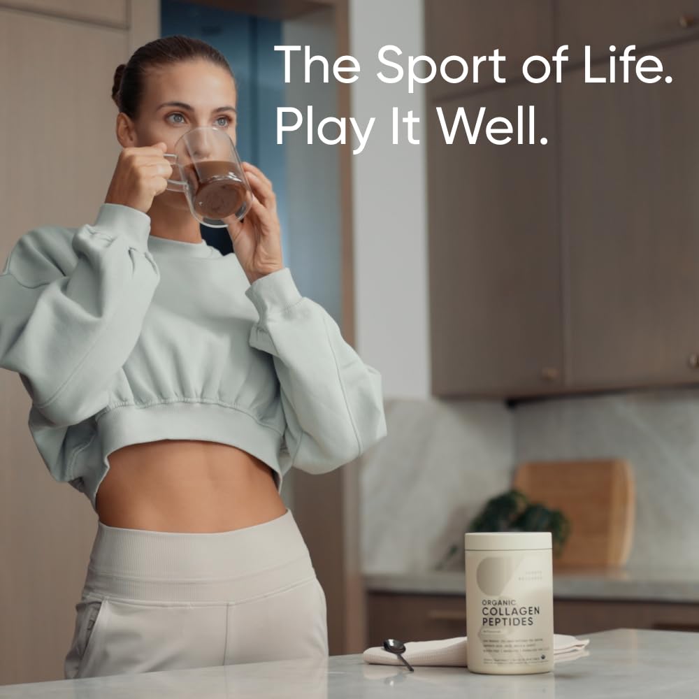 Woman in kitchen drinking from a mug next to Sports Research marine collagen peptides powder jar