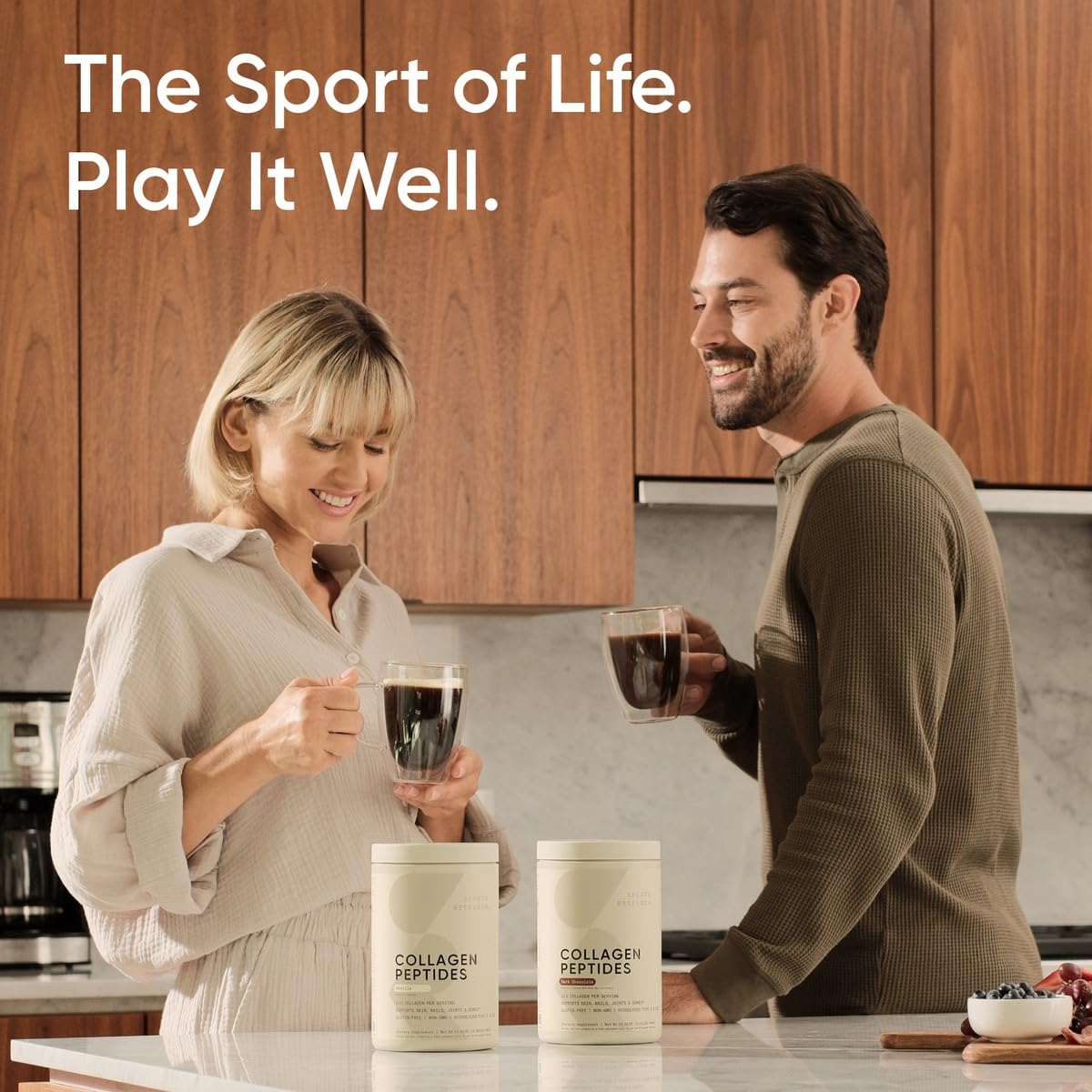 Couple in kitchen enjoying coffee with two Sports Research marine collagen peptides powder containers on counter