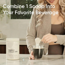 Hand holding a scoop of marine collagen peptides powder over a mug