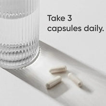 Capsules on a countertop with "Take 3 capsules daily" instruction text.