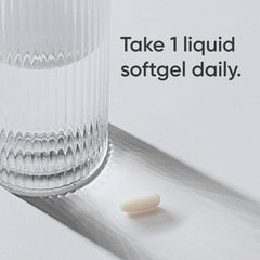 Sports Research L-theanine softgels single liquid softgel next to a ribbed glass with dosage text