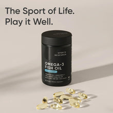 Omega-3 fish oil bottle with softgel capsules scattered nearby