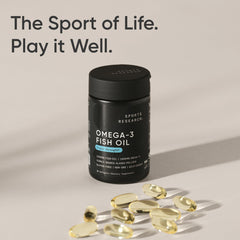 Sports Research omega 3 fish oil bottle with softgel capsules on beige background triple strength omega 3 fish oil supplement