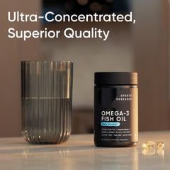 Sports Research triple strength omega 3 fish oil supplement in a black container beside a glass of water