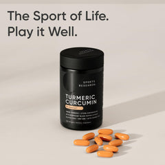 Sports Research turmeric curcumin supplement UAE bottle with orange softgels on beige backdrop