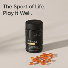 Sports Research D3+K2 supplement bottle with scattered orange softgels