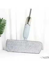 Spray mop with light blue microfiber pad attachment and upright handle