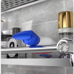 Huitich stainless steel bathroom shelf mounted on wall holding toiletries and a blue spray bottle