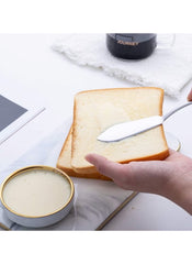 Huitich stainless steel butter knife set spreading butter on a slice of bread