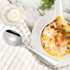 Huitich high-quality stainless steel dinner spoon set with polished finish beside creamy baked dish and lemon water