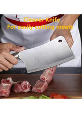 Chef knife with stainless blade and white handle, cutting meat on a board