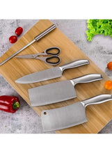 Assorted stainless steel kitchen knives with black handles on a wooden board