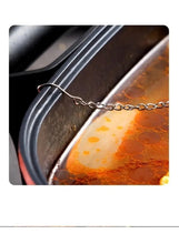 Tea infuser chain across pot rim with stainless steel mesh ball