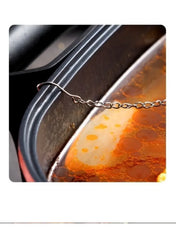 stainless-steel-tea-infuser-ball-resting-on-pot-side -- Mumzar
