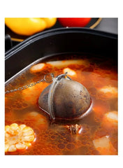 stainless-steel-tea-infuser-ball-simmering-in-broth -- Mumzar