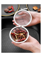 stainless-steel-tea-infuser-ball-with-spices-in-hand -- Mumzar