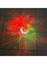 Astronaut night light projecting red, green, and blue starfield wall art
