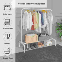 White garment rack with hanging clothes and lower shoe shelf, showing a wicker storage bin
