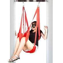 Door-mounted pull up bar with red suspension straps for bodyweight training