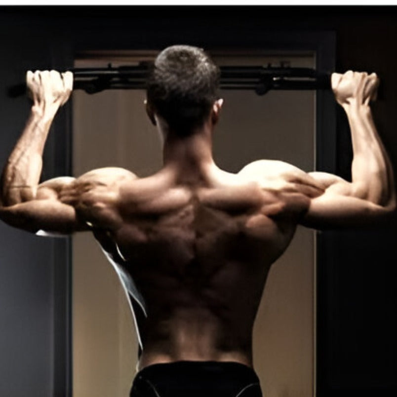 Muscular man doing pull-ups demonstrating Huitich steel push up bars for strength training