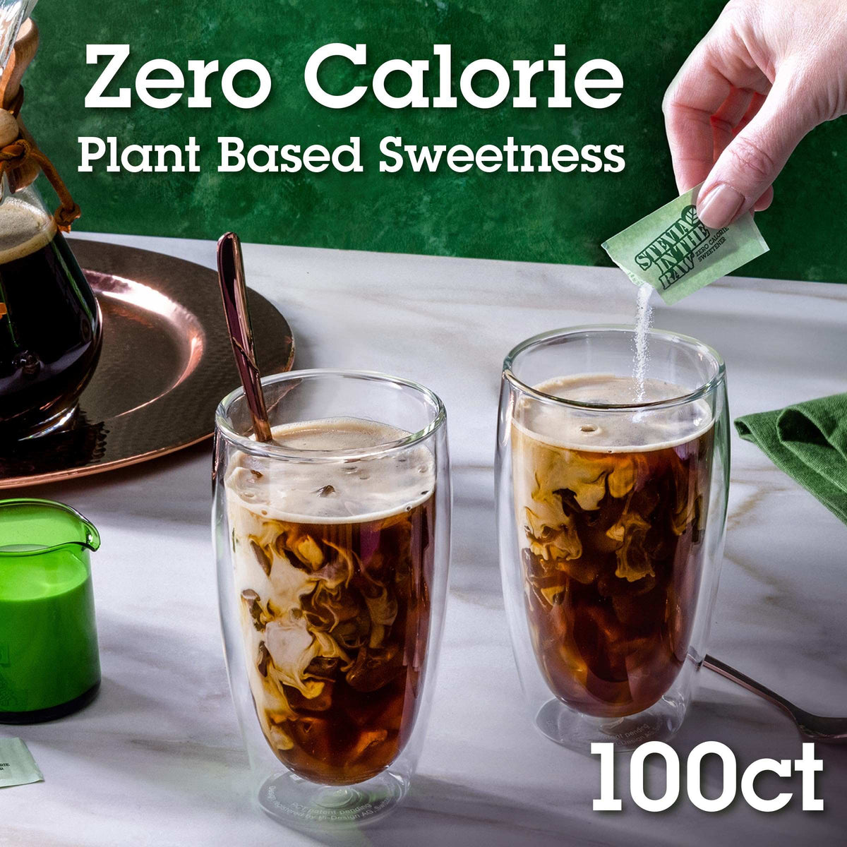Hand pouring stevia sugar substitute 100 count packet into iced coffee with cream swirl and two glasses