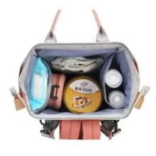 Open pink baby travel backpack with inner mesh pocket and small storage compartments