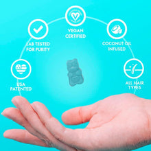 Hair vitamin gummy held above palm with vegan and lab tested icons