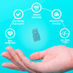 SugarBearHair blue gummy bear floating above open hand with vegan certified coconut oil icons vegan hair vitamins gummies
