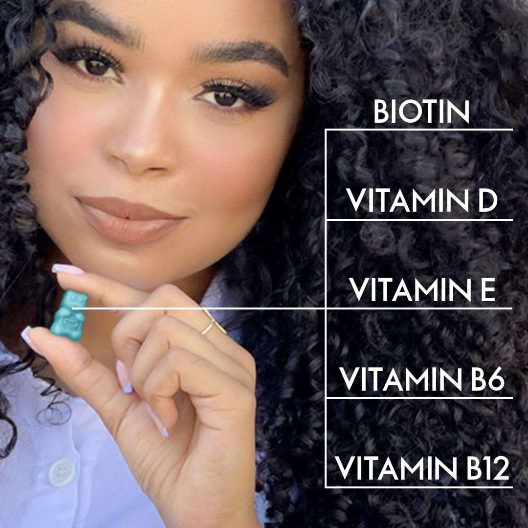 Model holding teal gummy with curly hair beside text listing Biotin Vit D Vit E Vit B6 B12 vegan hair vitamins gummies