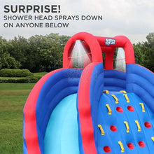 Inflatable bounce house tunnel and slide end, blue with red arches and mesh walls.