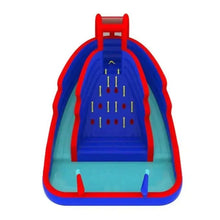 Inflatable bounce house with slide and climbing wall, blue and red with yellow pegs.