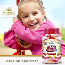 Kids Vitamin D3 cool gummies bottle held beside a smiling child