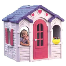 Purple and white outdoor playhouse toy with pink heart door and arched windows