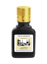 Oud perfume bottle, dark glass with gold cap and Swiss Arabian label, 9 ml